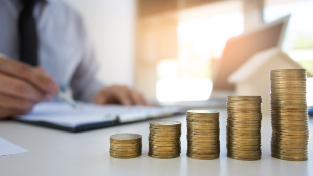 Stack Of Coins On Desk