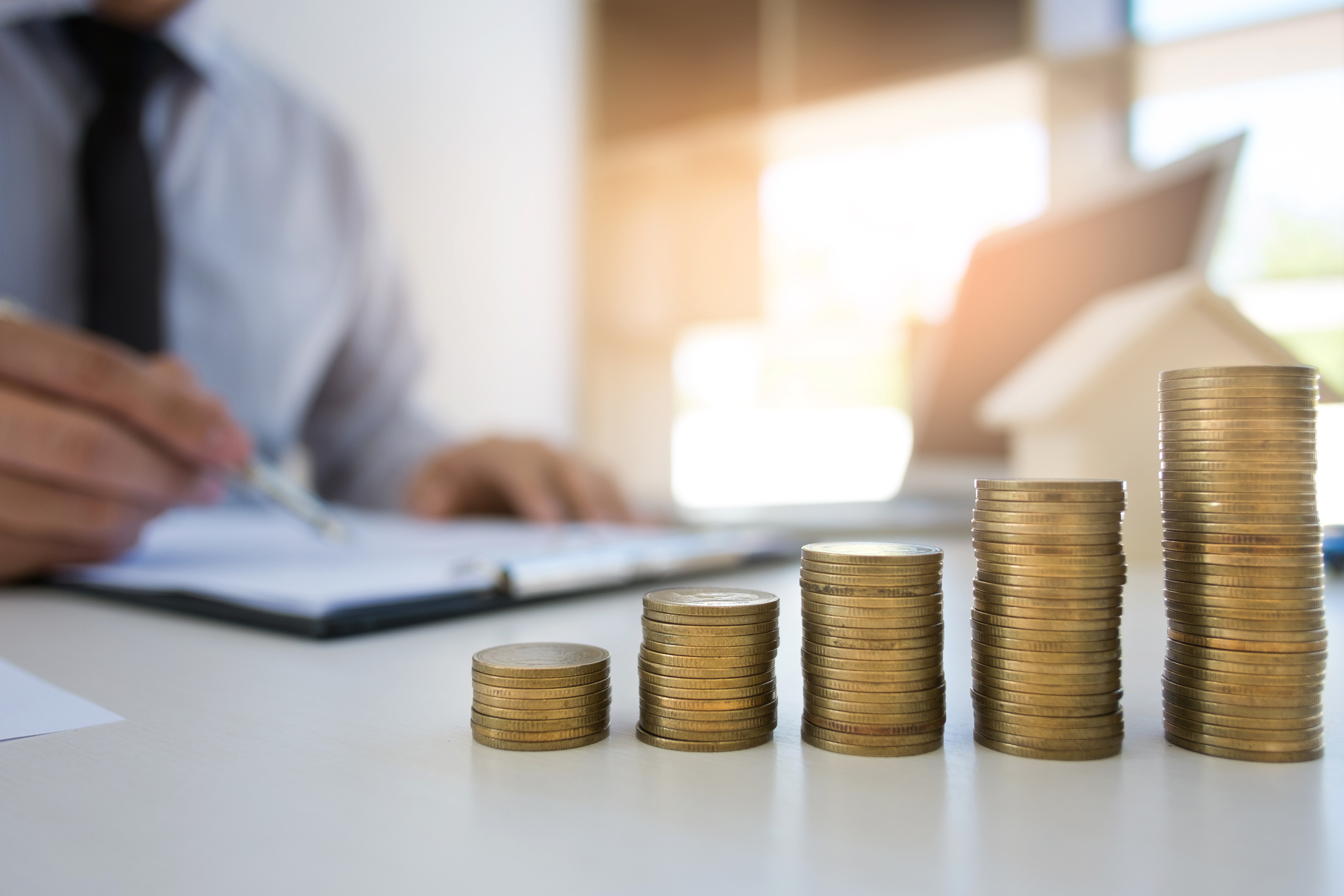 Stack Of Coins On Desk