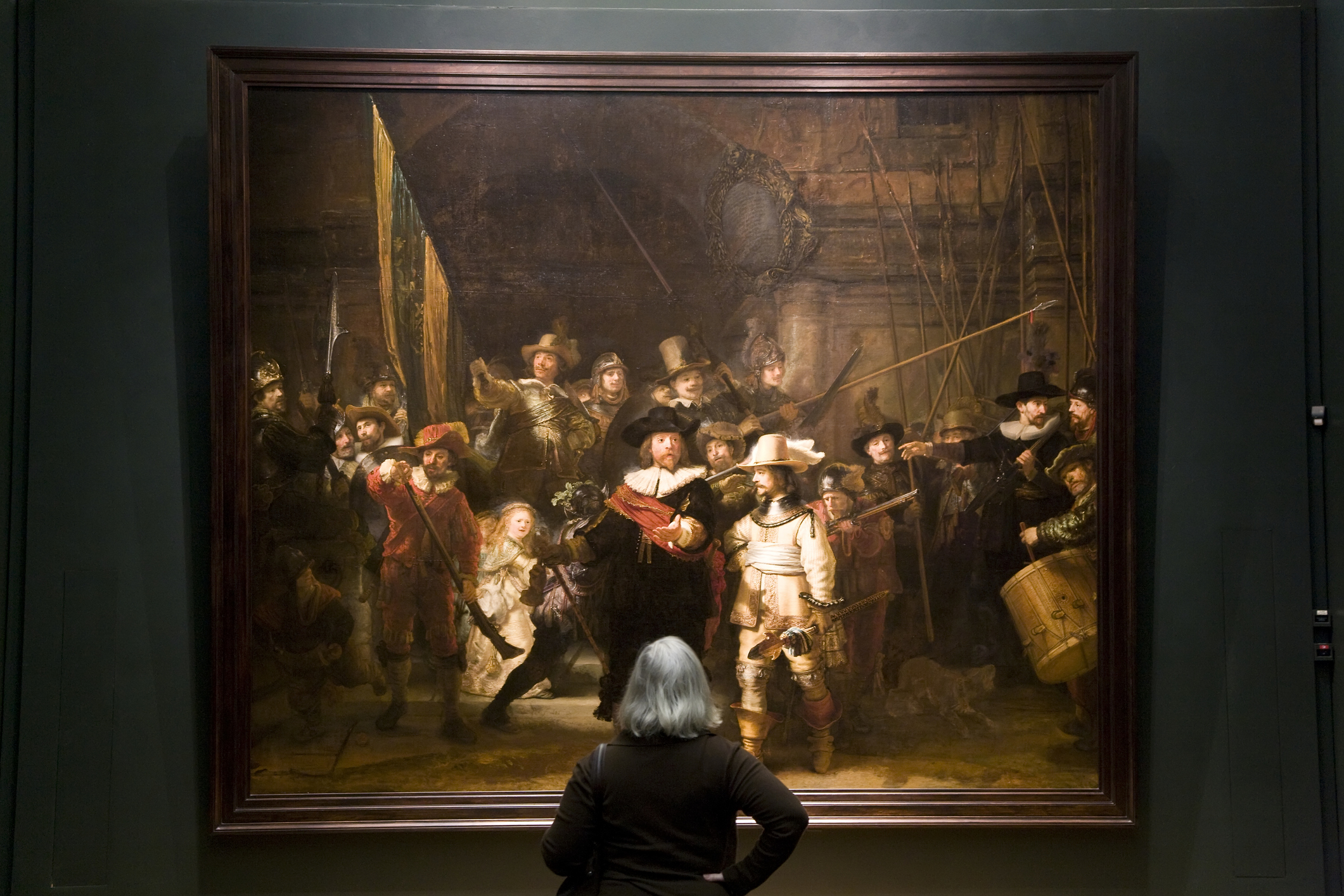 Museum Visitor Looking at Rembrandt Painting in Rijksmuseum