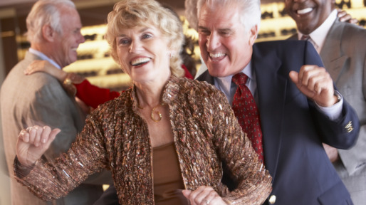 Couples Dancing Together At A Nightclub