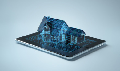Family house sitting on tablet pc