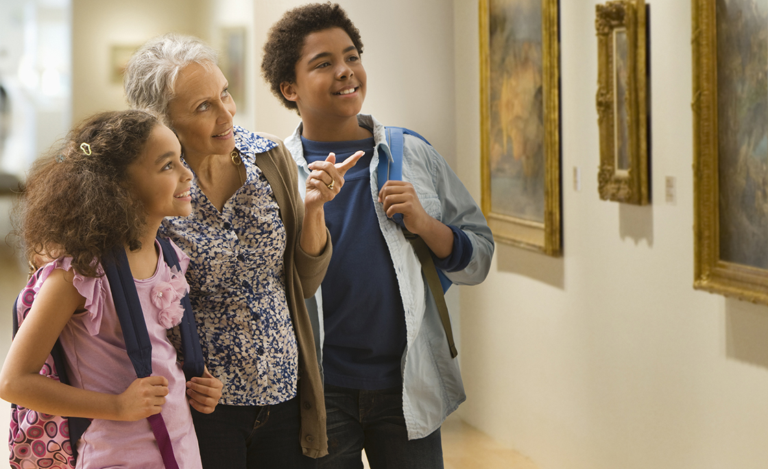 Grandmother and grandchildren visiting a museum