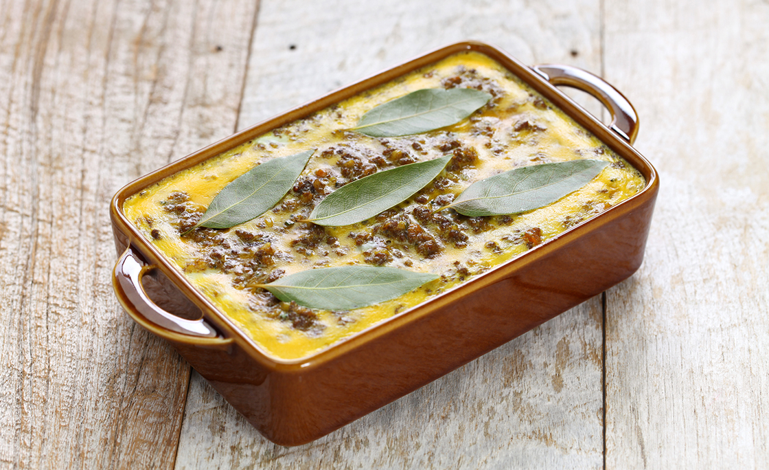 bobotie is a curry flavored meatloaf with baked egg on top.