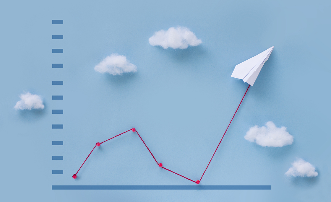 Conceptual paper plane pulling business finance growth chart still life image.