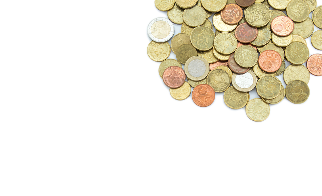 Heap of different Euro coins isolated on white background, viewed from above. Copy space.