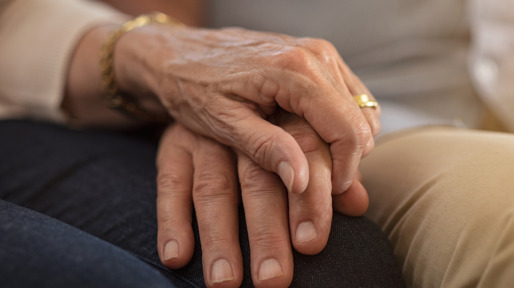 Senior couple holding hands