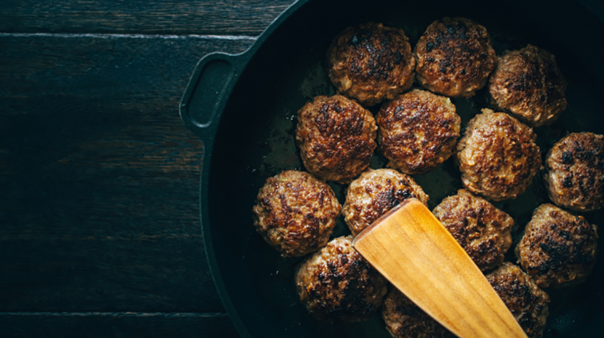Spatula With Meatballs In Cooking Pan