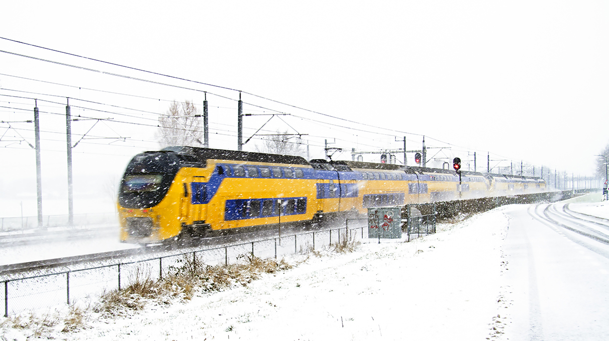 Train driving in a snowstorm the Netherlands