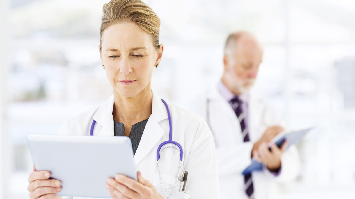 Female Doctor Using Digital Tablet In Hospital