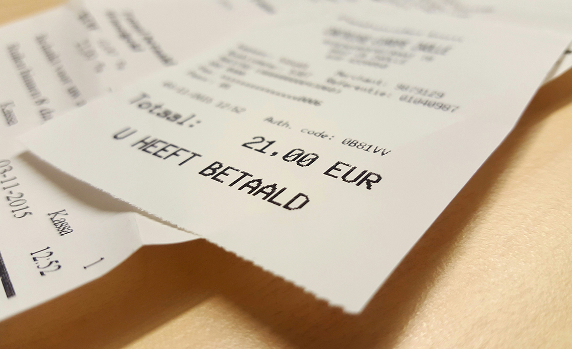 Close-Up Of Bills On Table