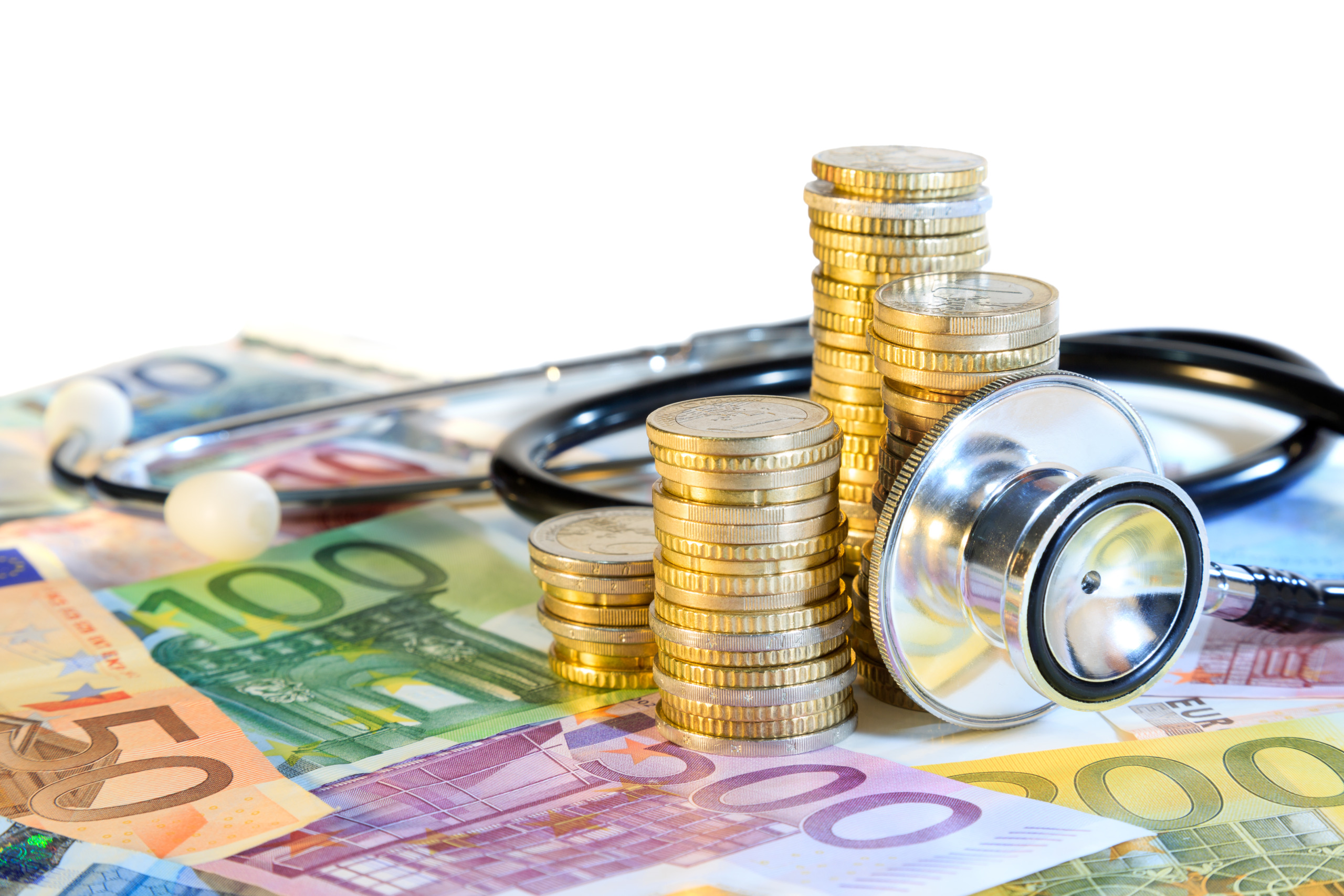 Bank notes and coins with a stethoscope around it