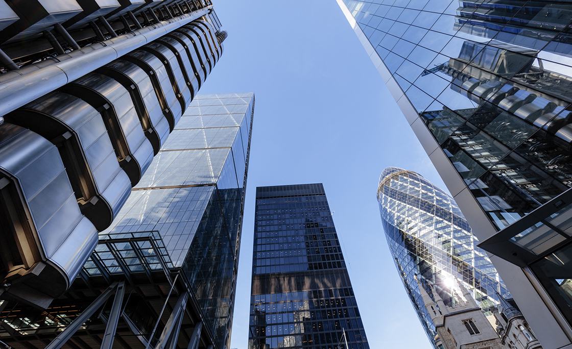 Looking up at futuristic city skyscrapers in London