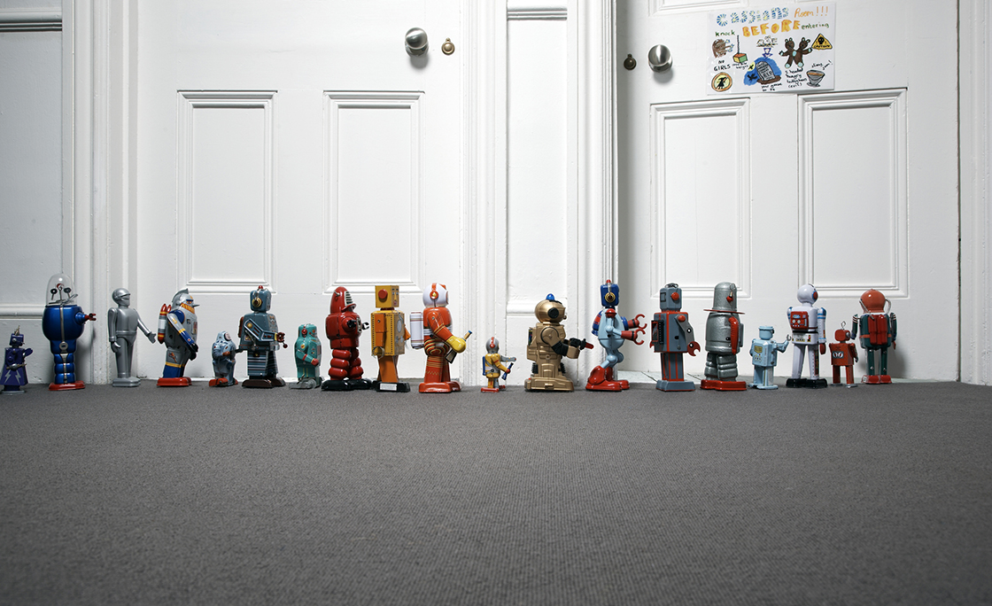 toy robots lined up outside childs bedroom