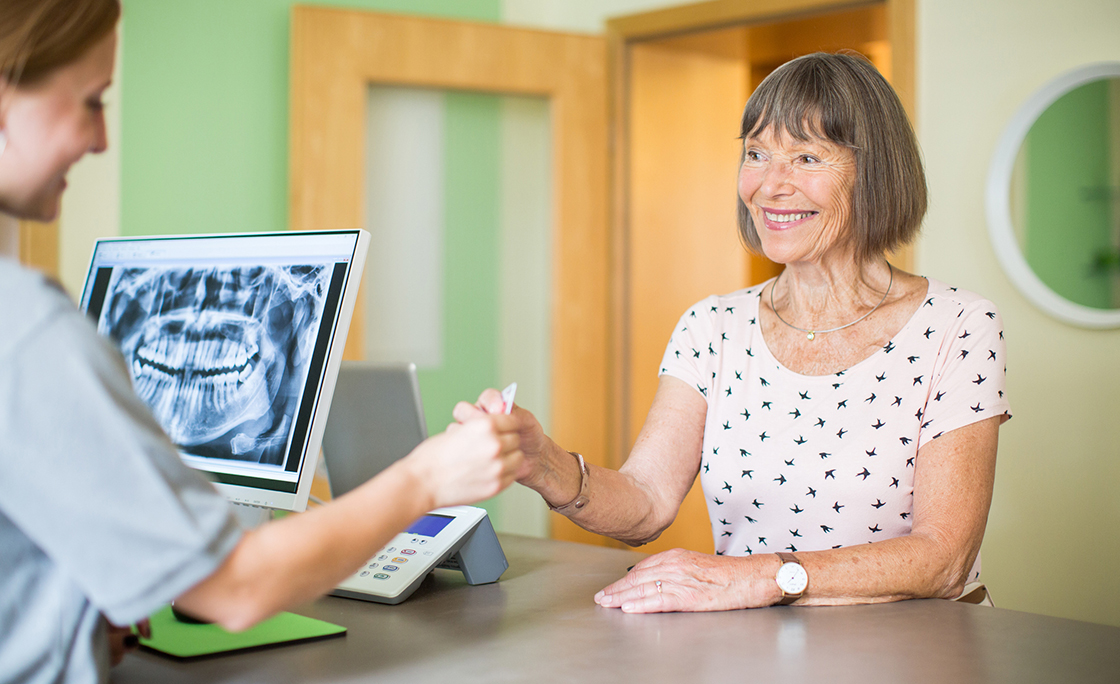 Senior woman at dental clinic for treatment