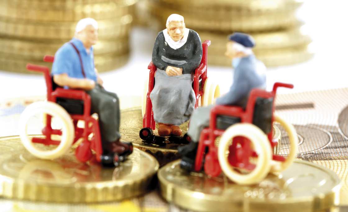 Figurines in wheelchairs on coins