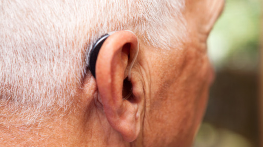 Senior Man’s Ear with Hearing Aid