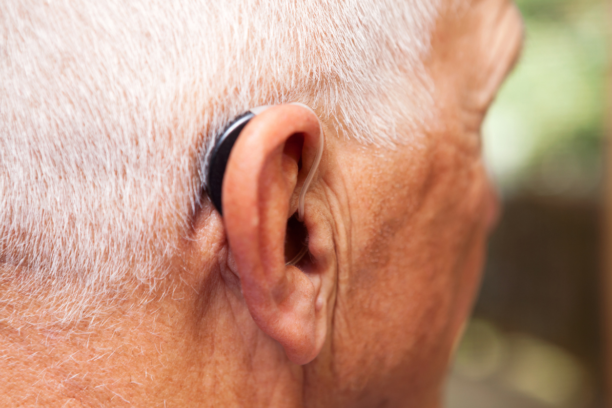 Senior Man’s Ear with Hearing Aid