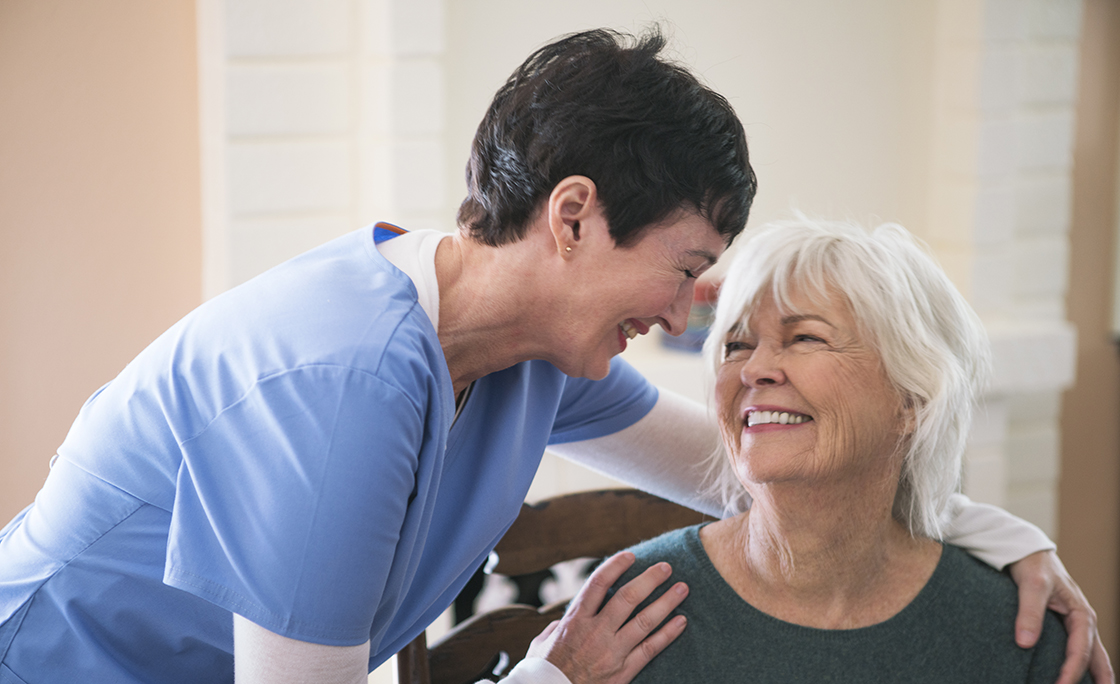 Nurse taking care of elderly lady