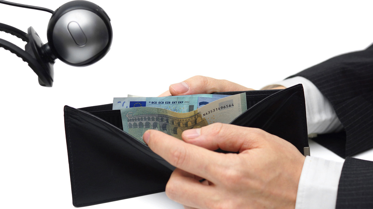 financial spying concept with wallet and camera