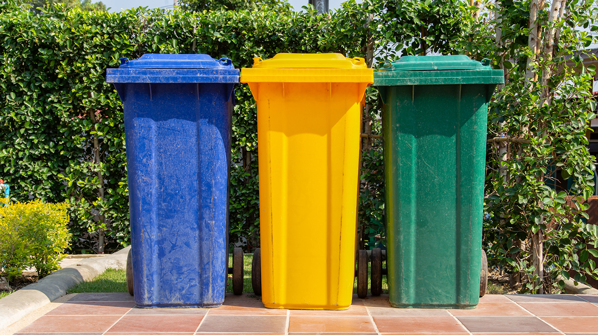 Colorful plastic bins for different waste types