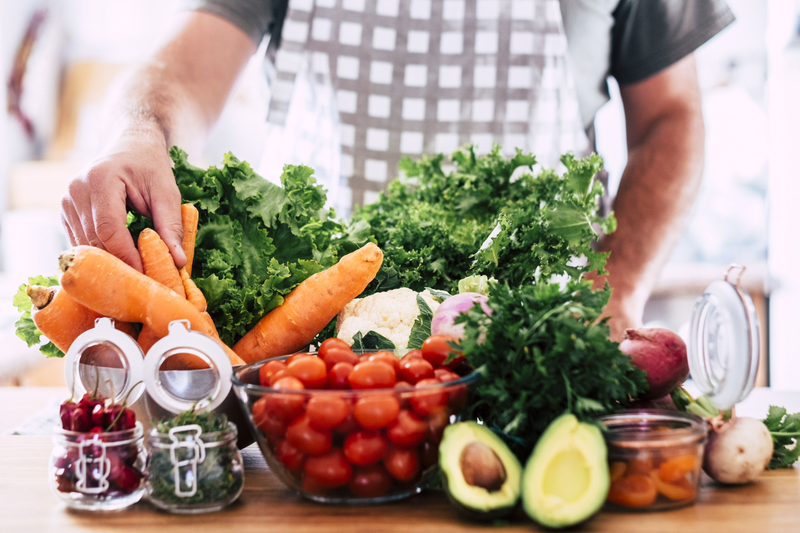 Midsection Of Man Preparing Food In Kitchen