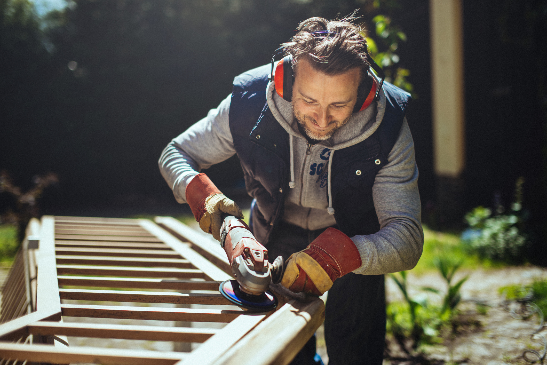 Smiling man grinding a handrail.