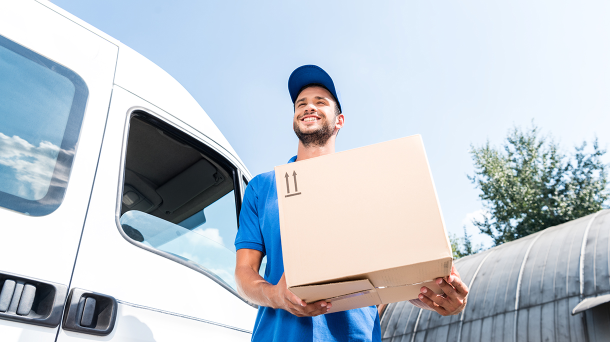 delivery man with cardboard box