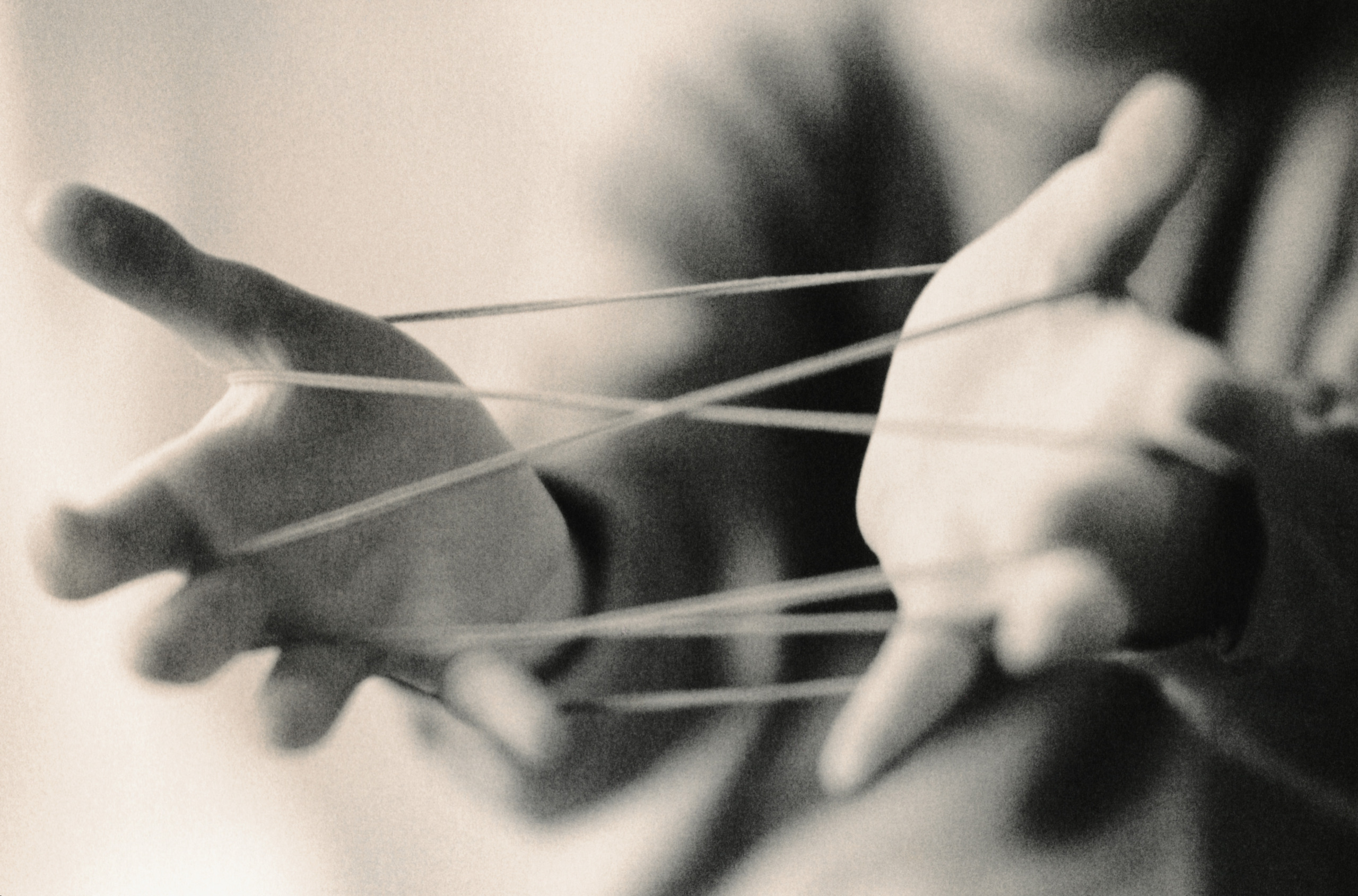 Boy Playing Cat’s Cradle