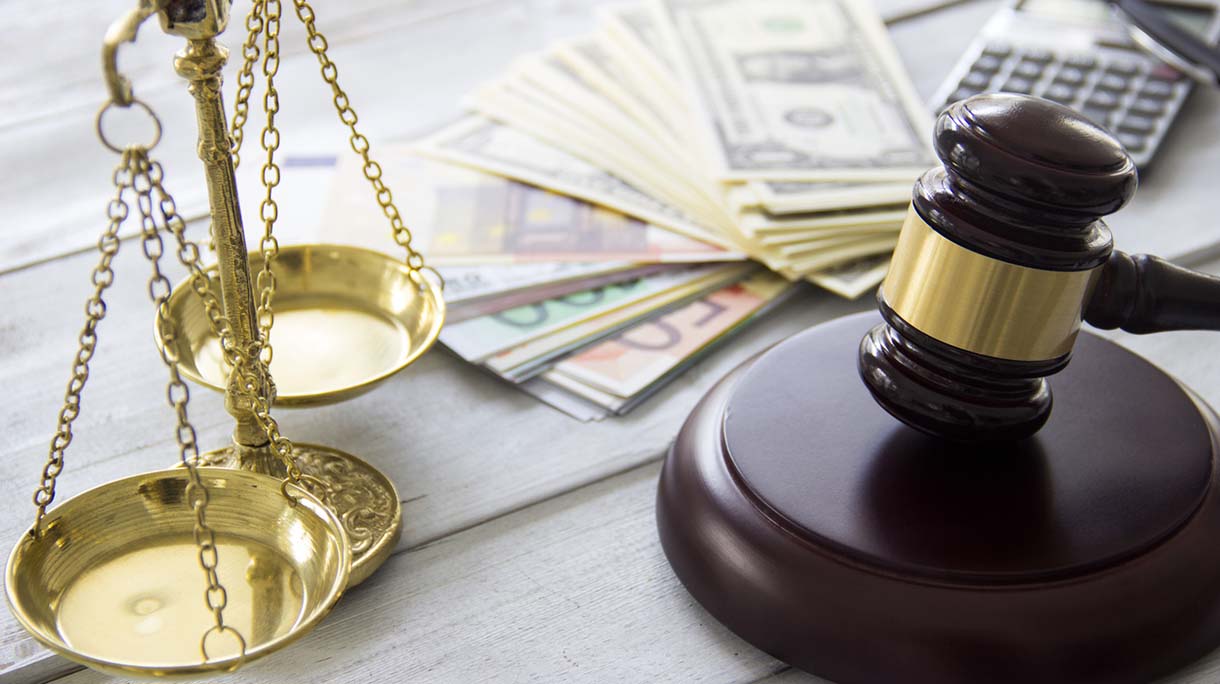 Labor law concept, scale, gavel, money and calculator