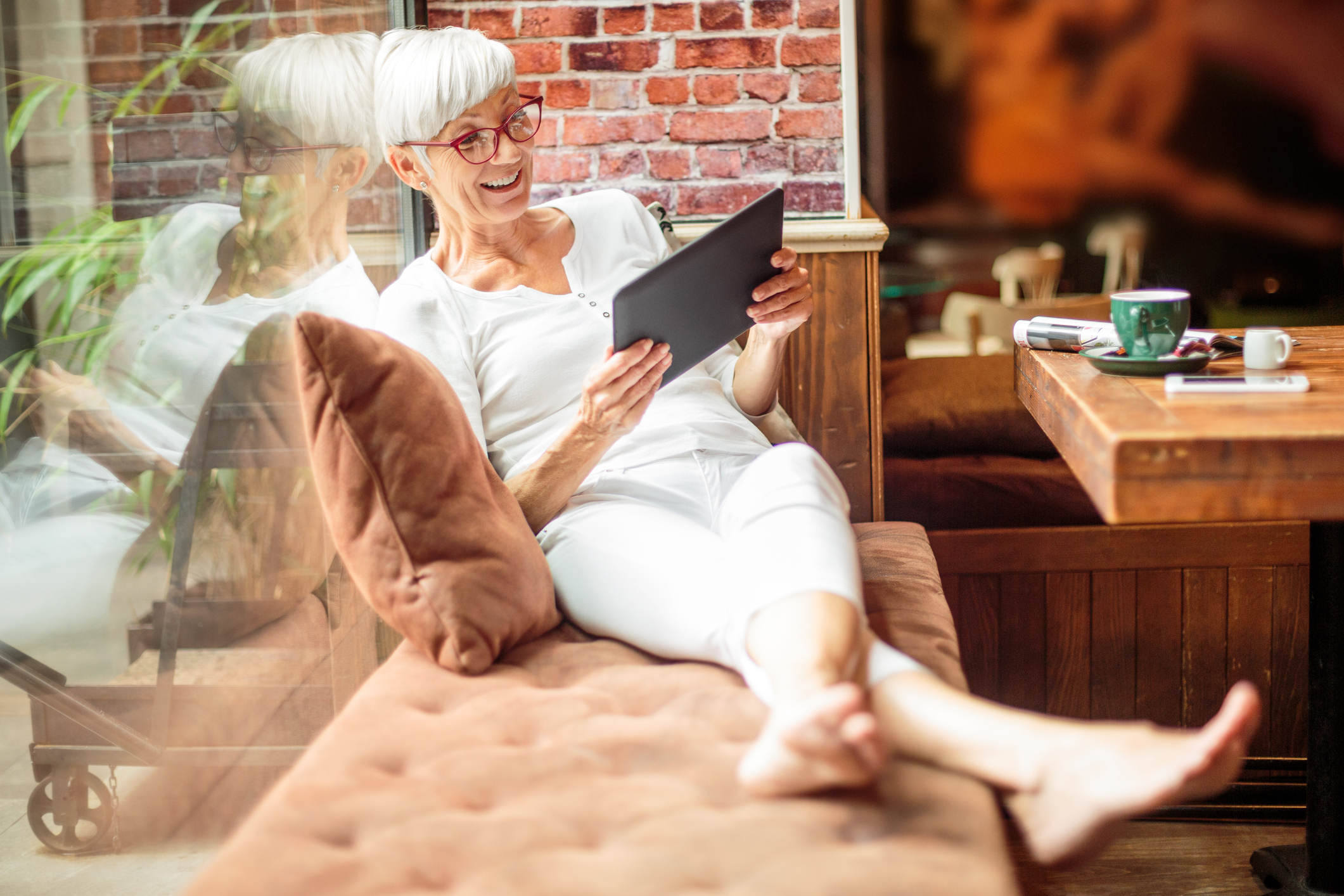 Senior woman with digital tablet