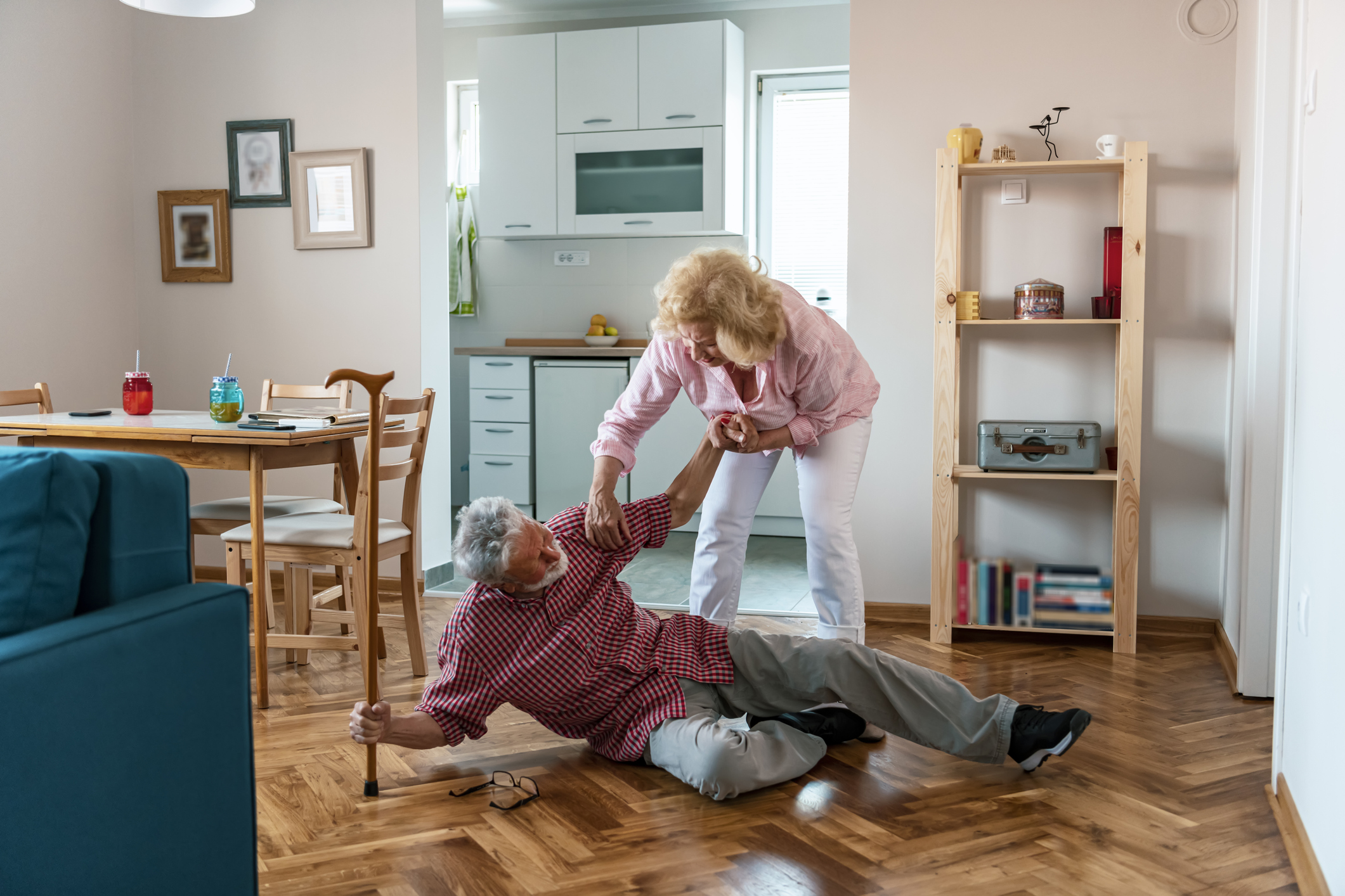 Old women helping husband who falled down on floor