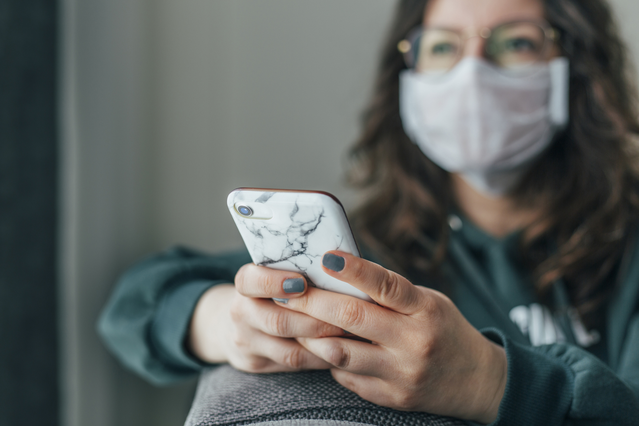 Worried Woman is Reading News on Phone