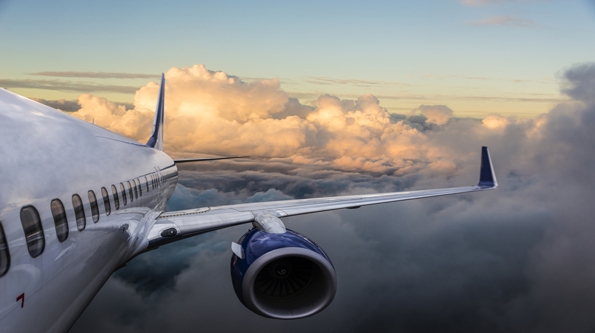 Body of an Airplane Flying Above Cloud
