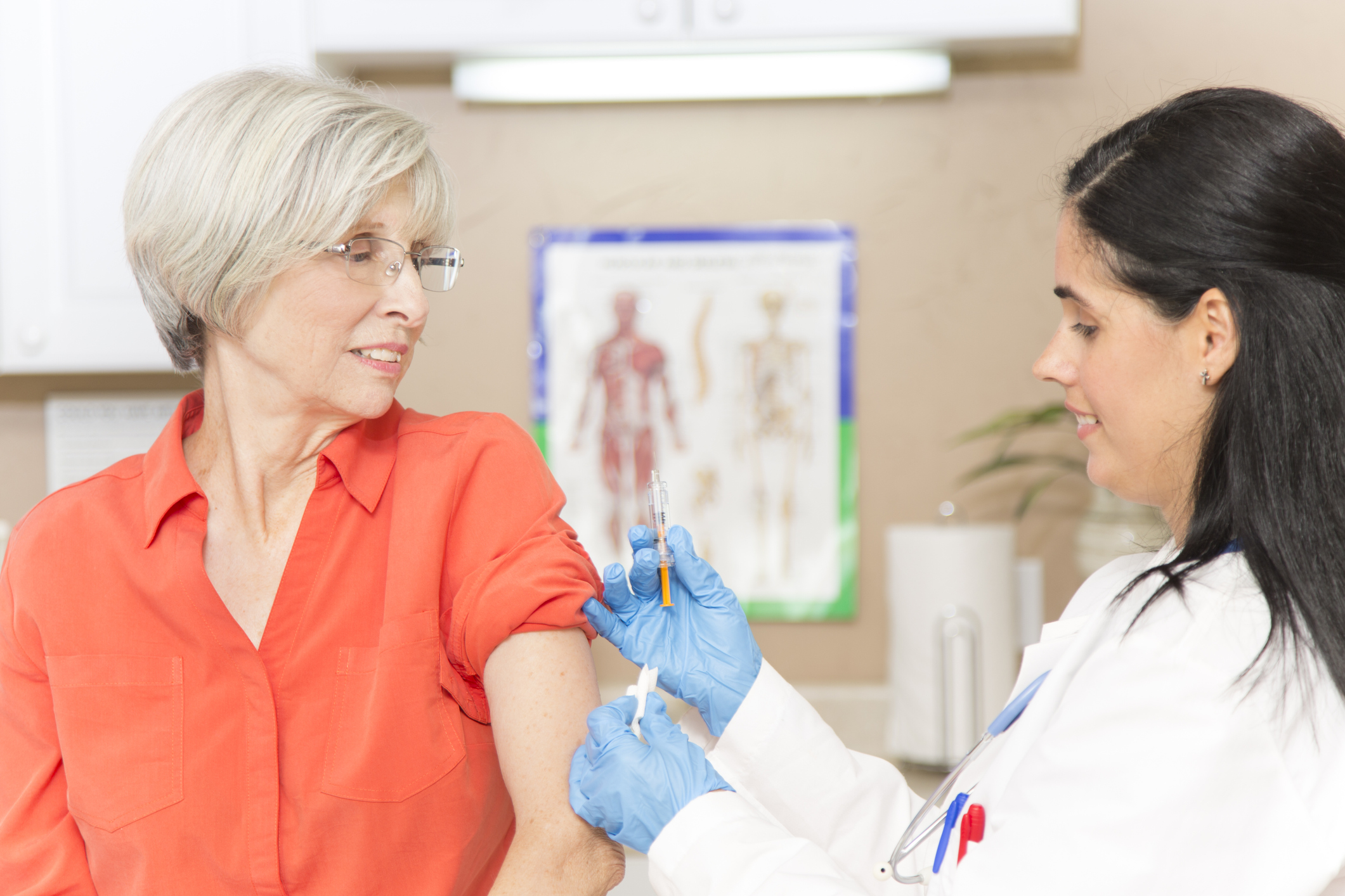 Senior adult, woman patient at female doctor’s office.
