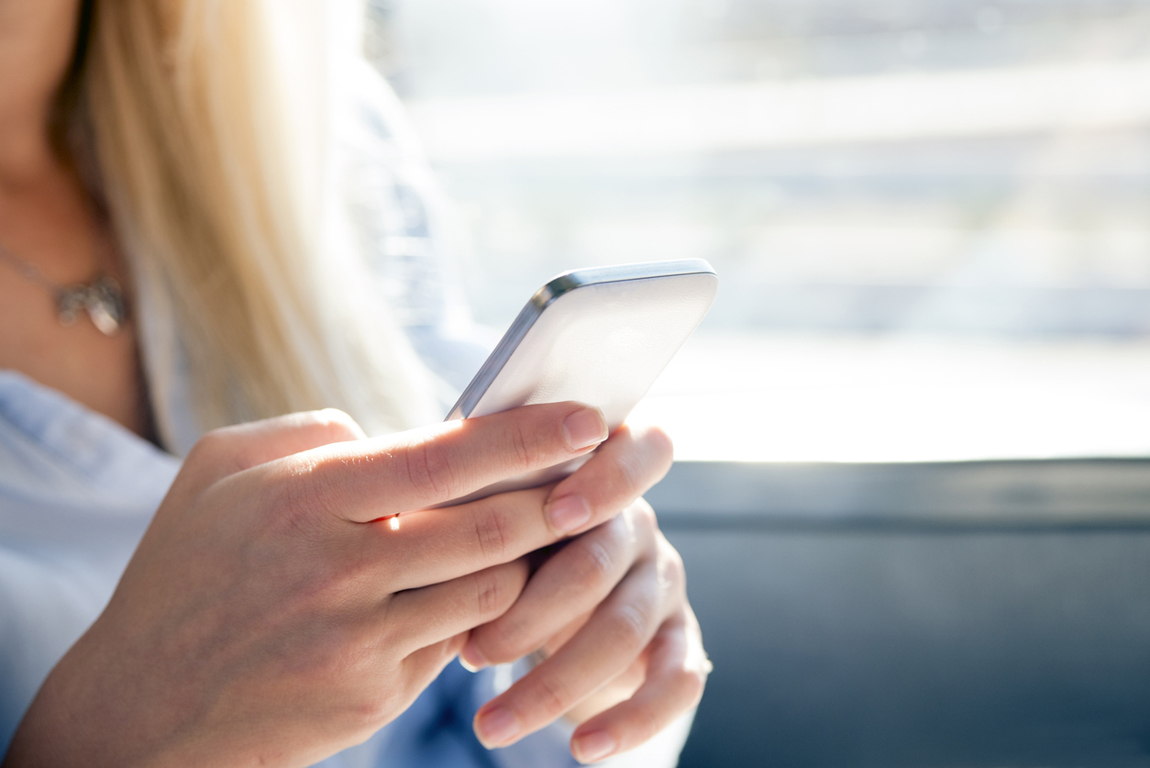 Women using her Smartphone and texting