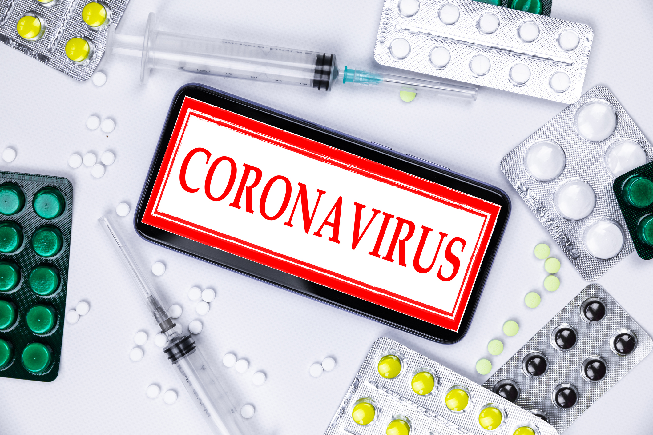 China, Wuhan. Smartphone with Aliepress logo with pills and vaccine. Novel coronavirus 2019-nCoV.