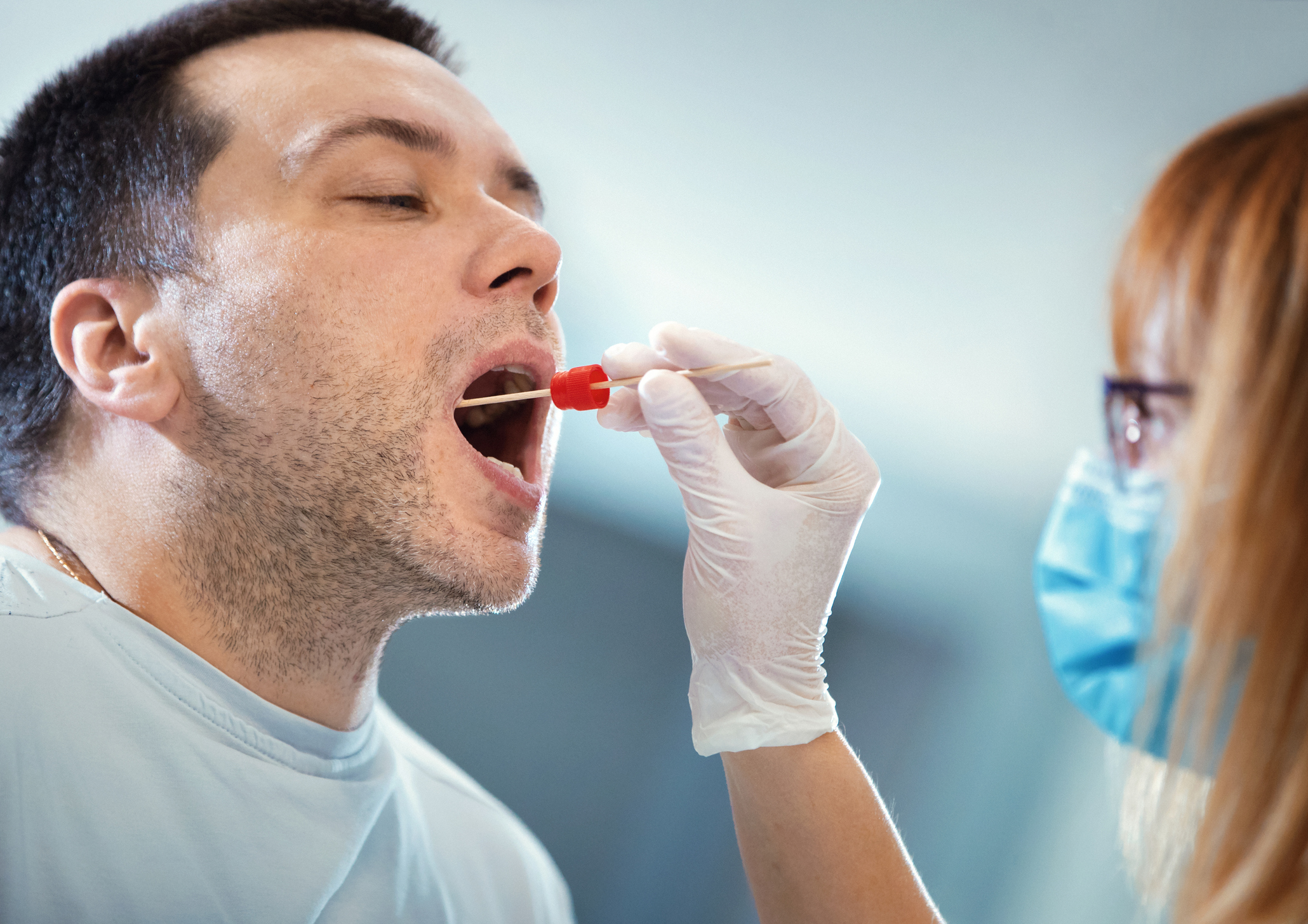 Throat culture sampling.