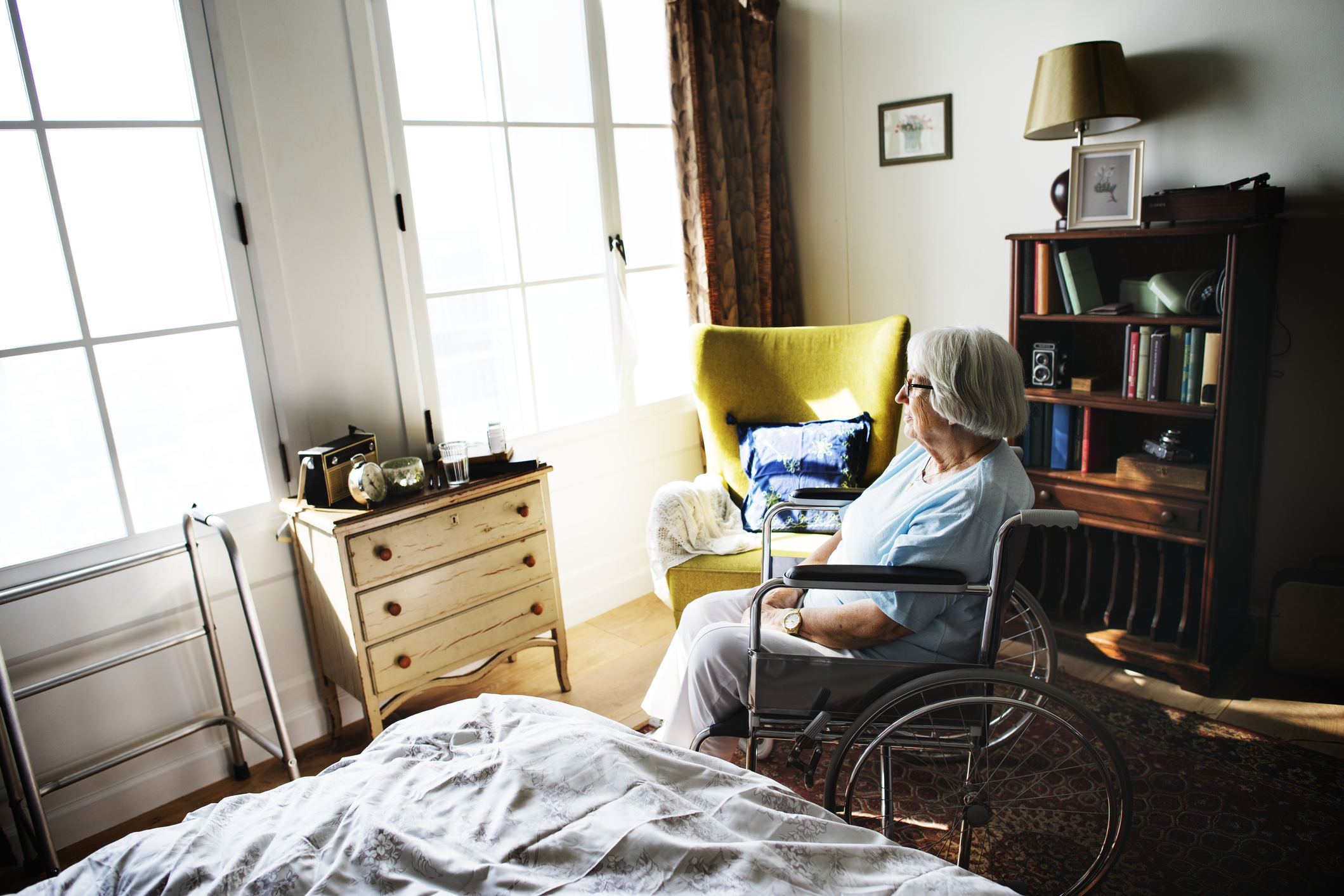 Senior woman sitting on the wheelchair alone