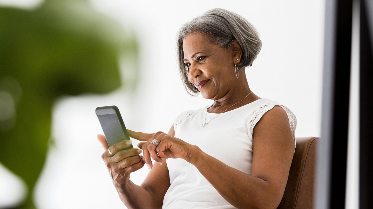 Woman participates in video call with family