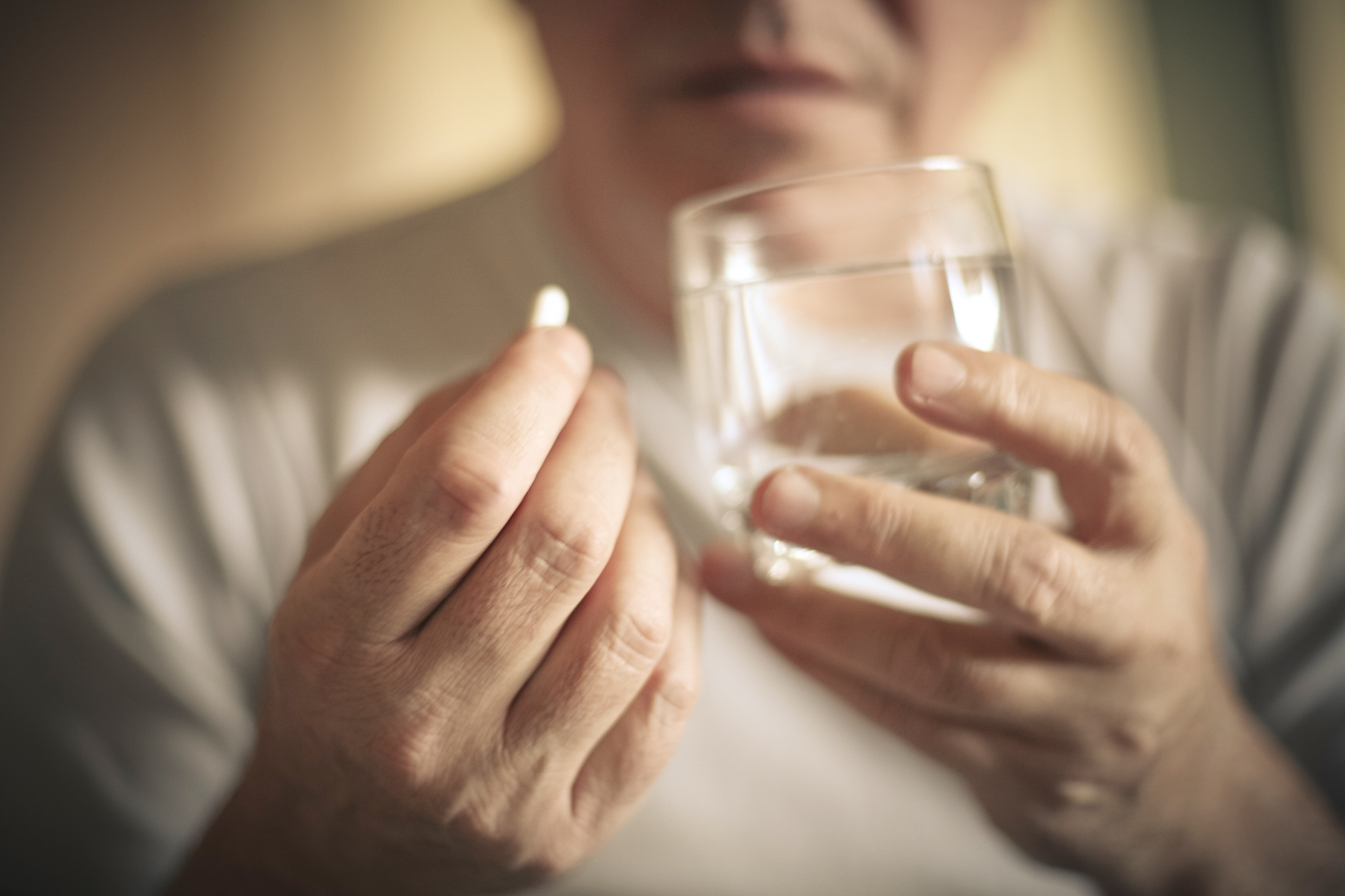 Taking pill.