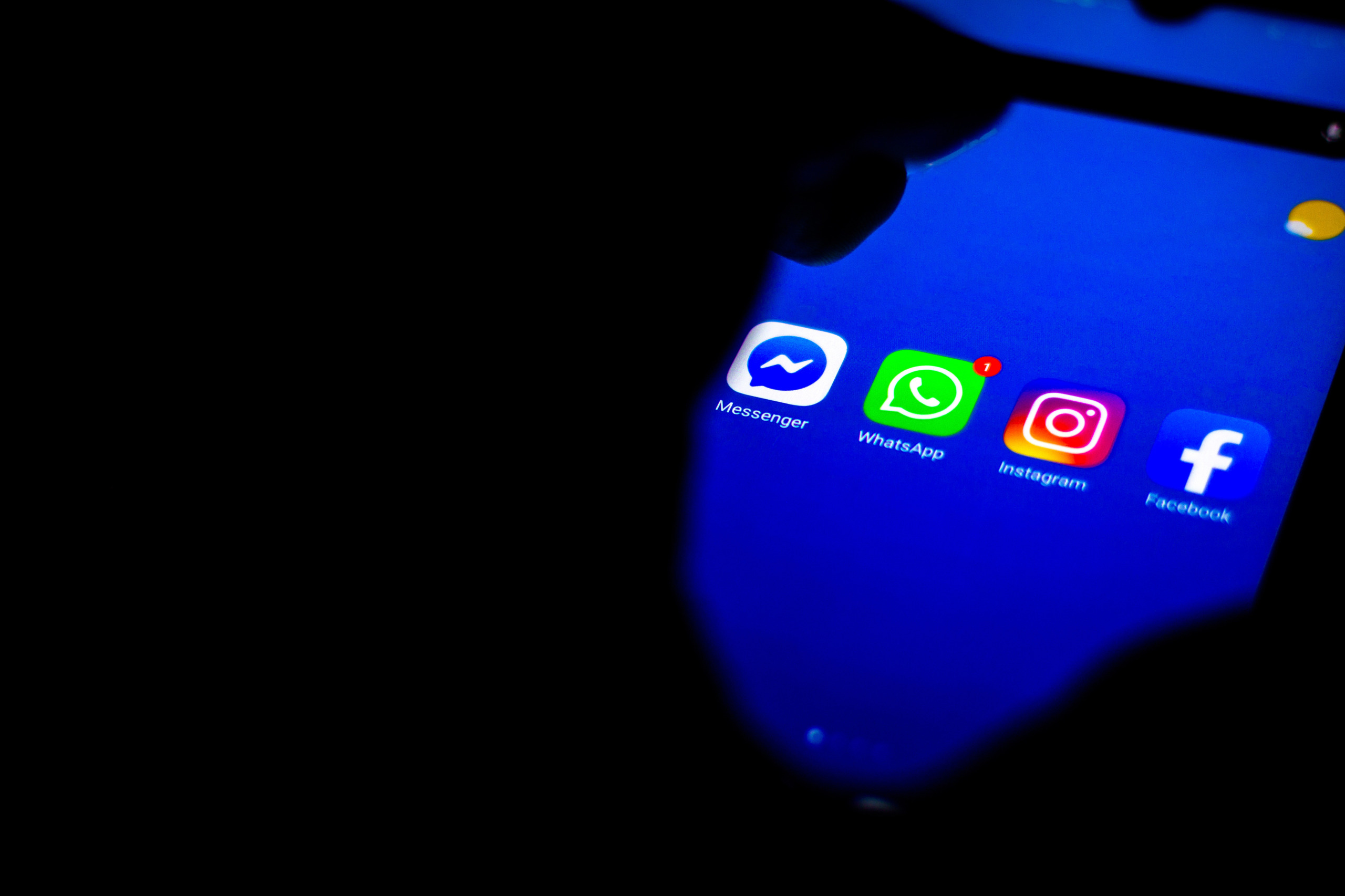 In this photo illustration the social media icons (Messenger