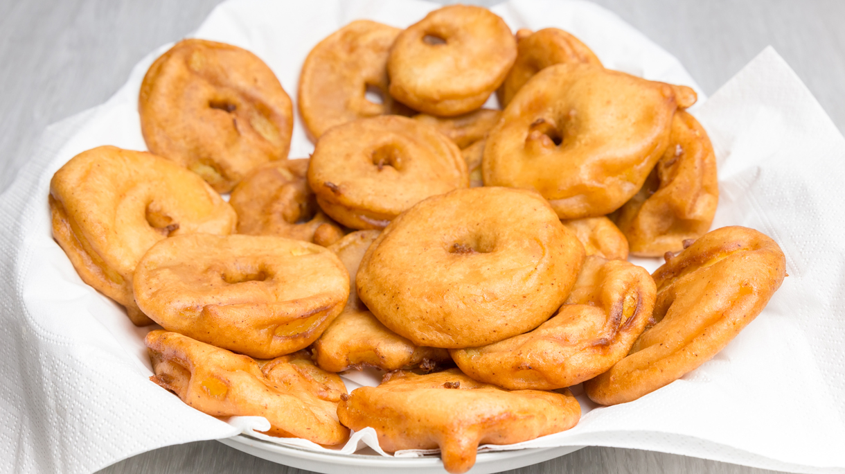 Apple fritters on napkins in scale