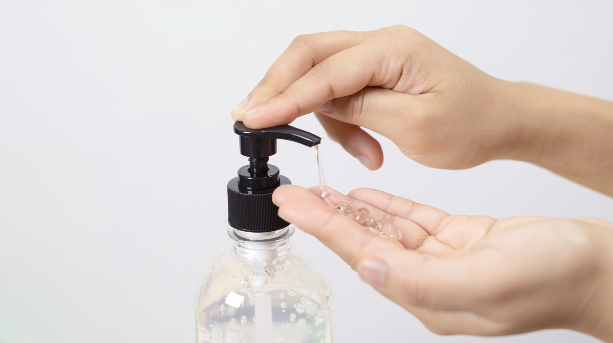 women is washing hands with alcohol gel for protect against Covid 19 virus and bacteria