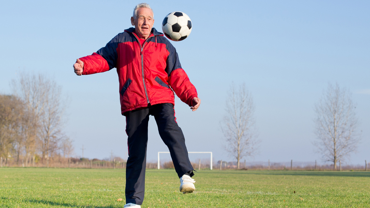 Old man playing football