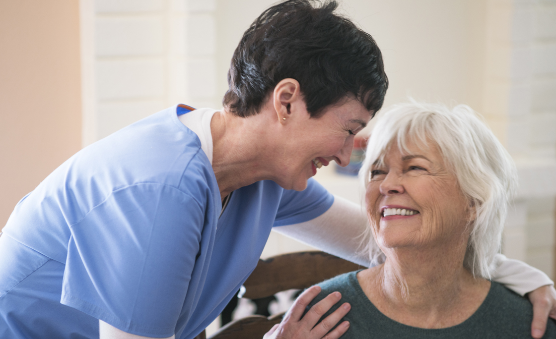 Nurse taking care of elderly lady