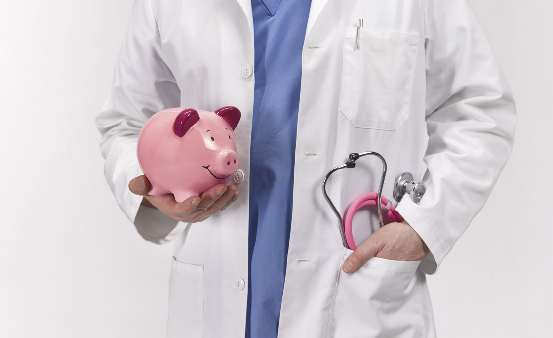 Doctor with piggy bank