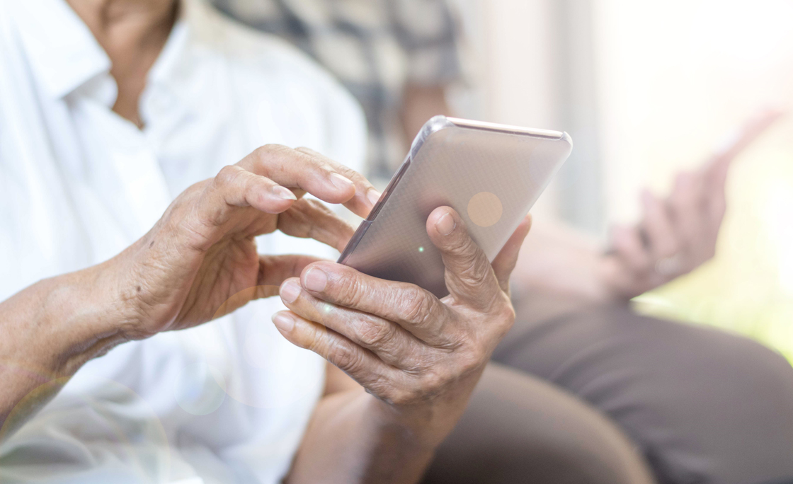 Happy elderly senior people society lifestyle technology concept. Ageing Asia women using tablet smartphone or mobile phone share social media together in wellbeing county home.