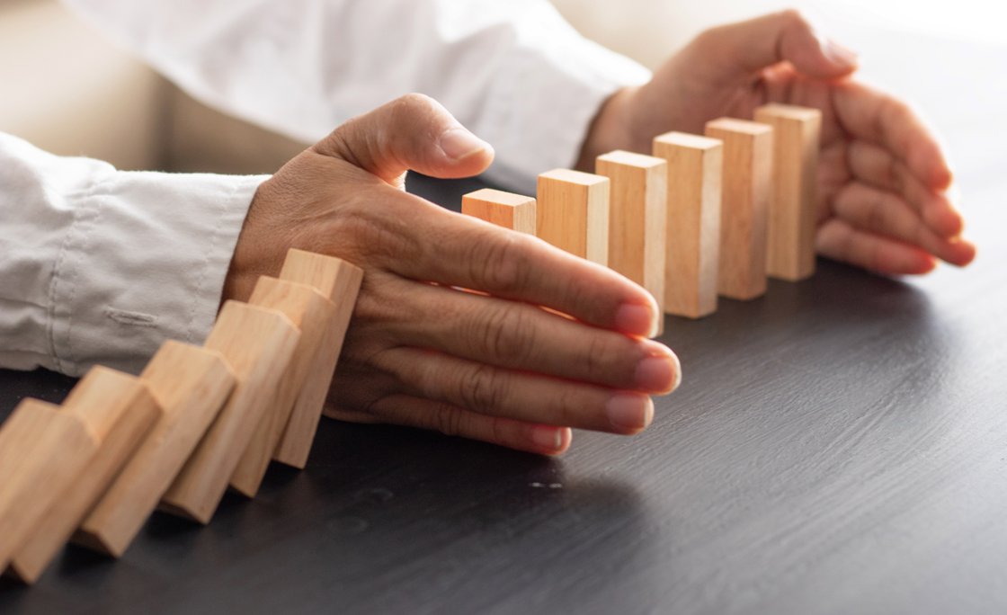 Business man placing wooden block on a tower concept risk control, Planning and strategy in business.Alternative risk concept,Risk To Make Buiness Growth Concept With Wooden Blocks