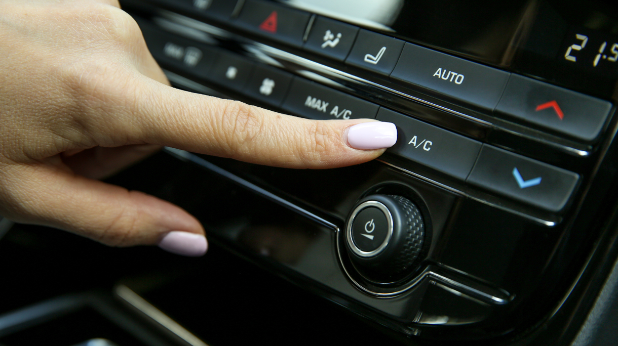 pushing a/c button inside car