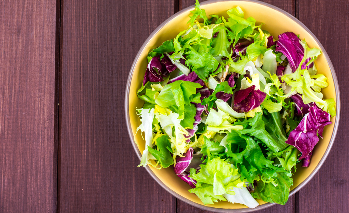 Concept of vegetarian diet. Fresh leaves of different salads